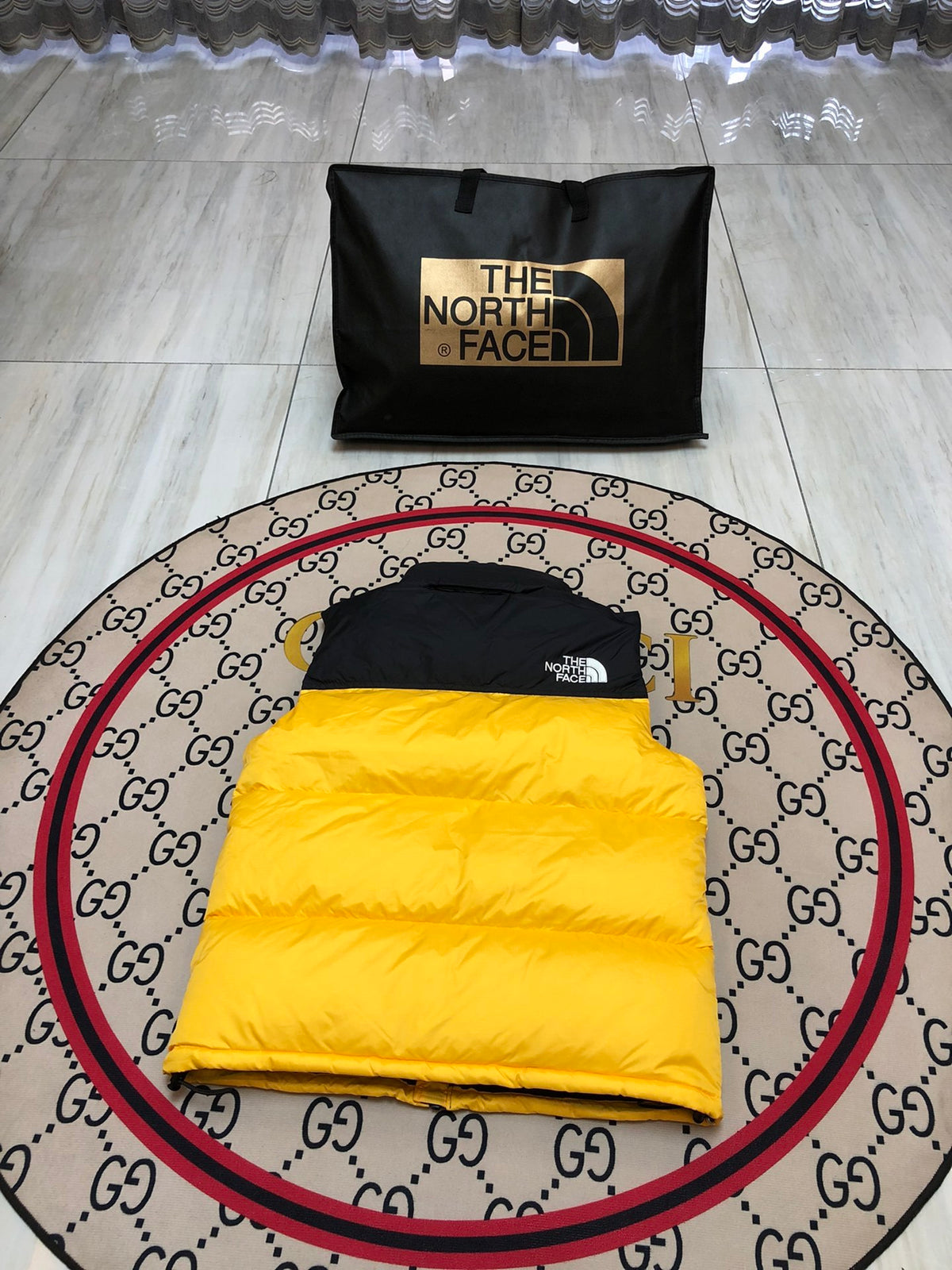 The North Face Yellow and Black Colorblock Puffer Vest