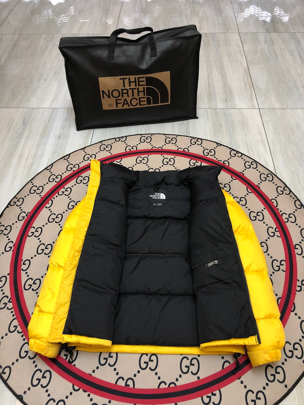 The North Face Yellow and Black Colorblock Puffer Jacket
