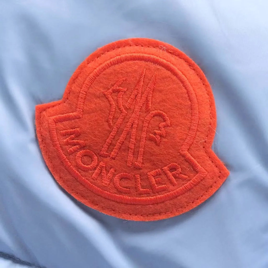 Moncler Light Blue Hooded Quilted Puffer Jacket with Orange Logo